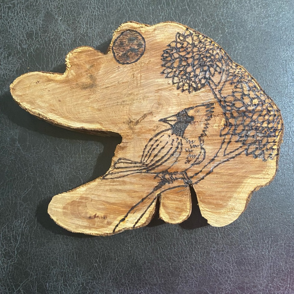 Wood burning authentic wood cedar wood tree , cardinal bird